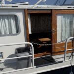 Niederländische Motoryacht Smelne 1140 Dreamflower (1985) – Seitentür und Steuerborddeck
