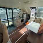 Flusskreuzer Nicols 1100 Lodève (1998) – Salon, Küche und Zugang zum Achterdeck