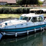 Flusskreuzer Nicols 1100 Lodève (1998) – Seitenansicht backbord in Fahrt auf dem Kanal